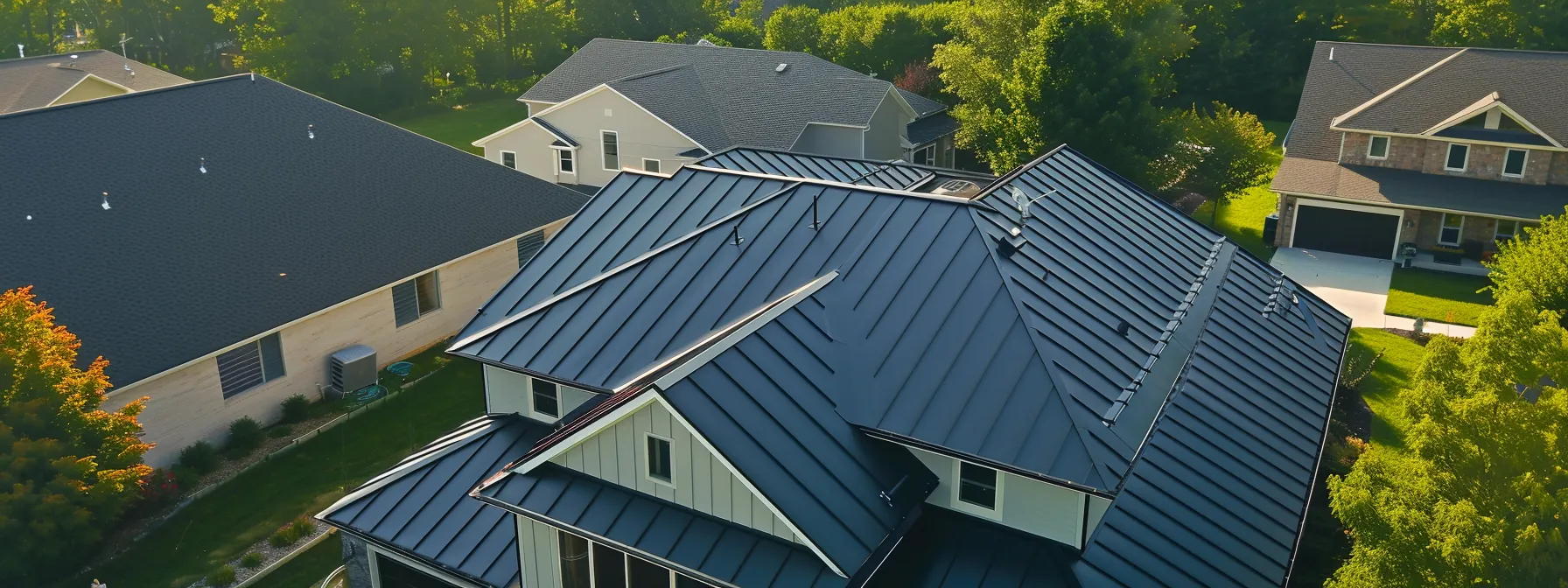 a group of roofers inspecting a steel roof on a centennial home.