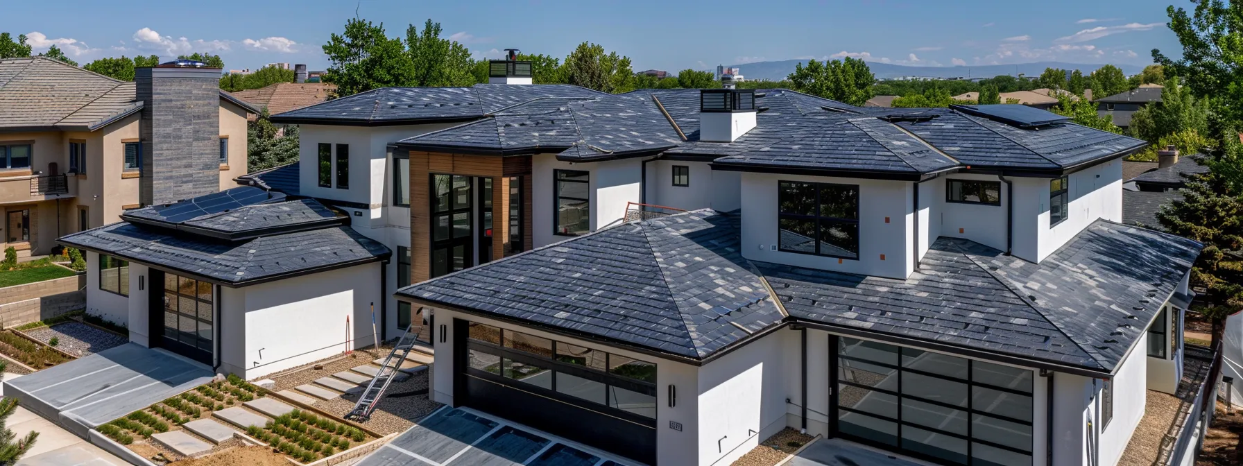 a sleek, modern roof being expertly replaced on a beautiful home in centennial, co by legacy roofing.