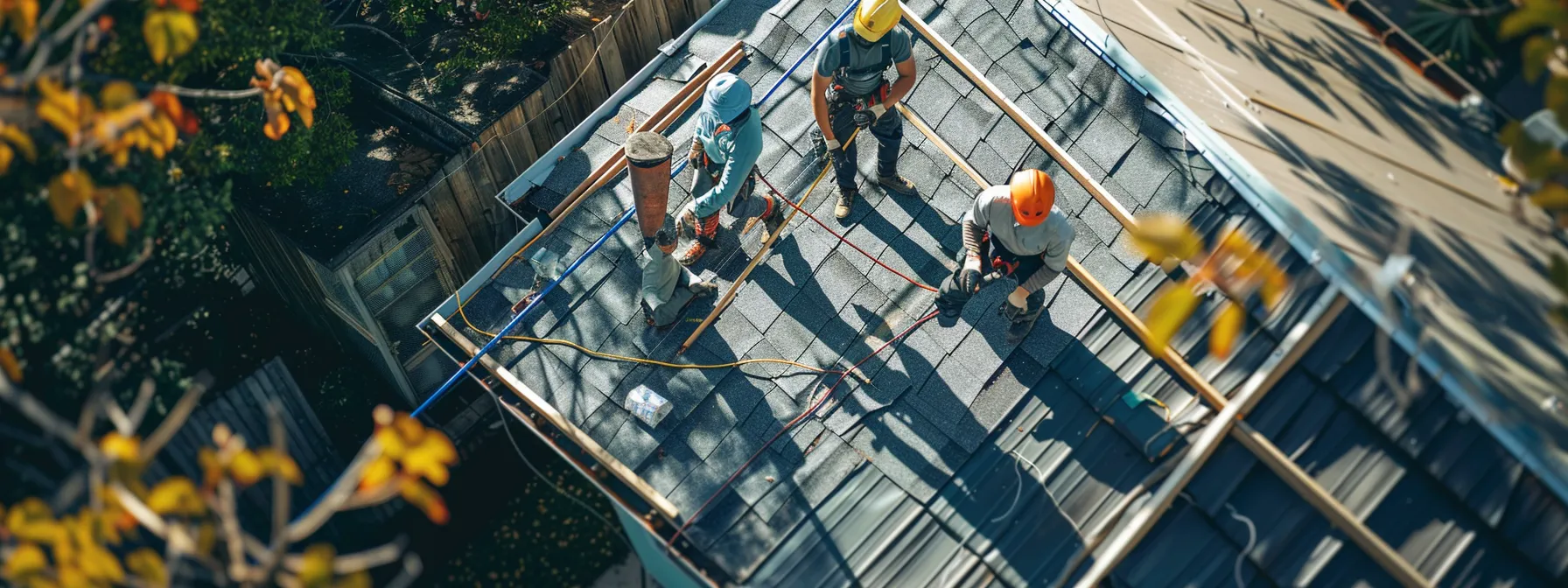 a team of workers applying eco-friendly roofing materials onto a house.