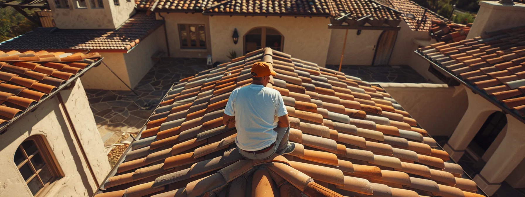 a skilled roofer carefully inspecting a high-quality clay tile roof installation in centennial.